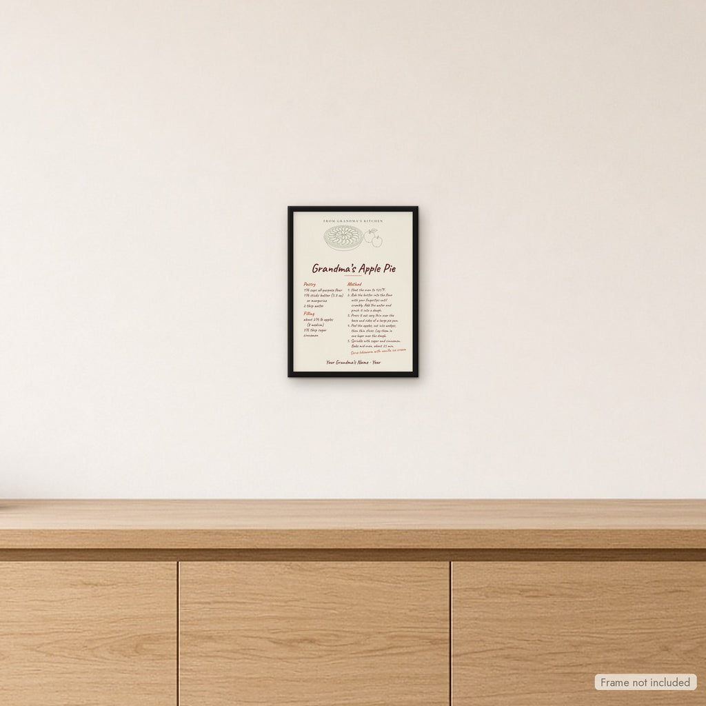 Inramad äppelpajsposter Grandma's Apple Pie på ljus vägg i köket